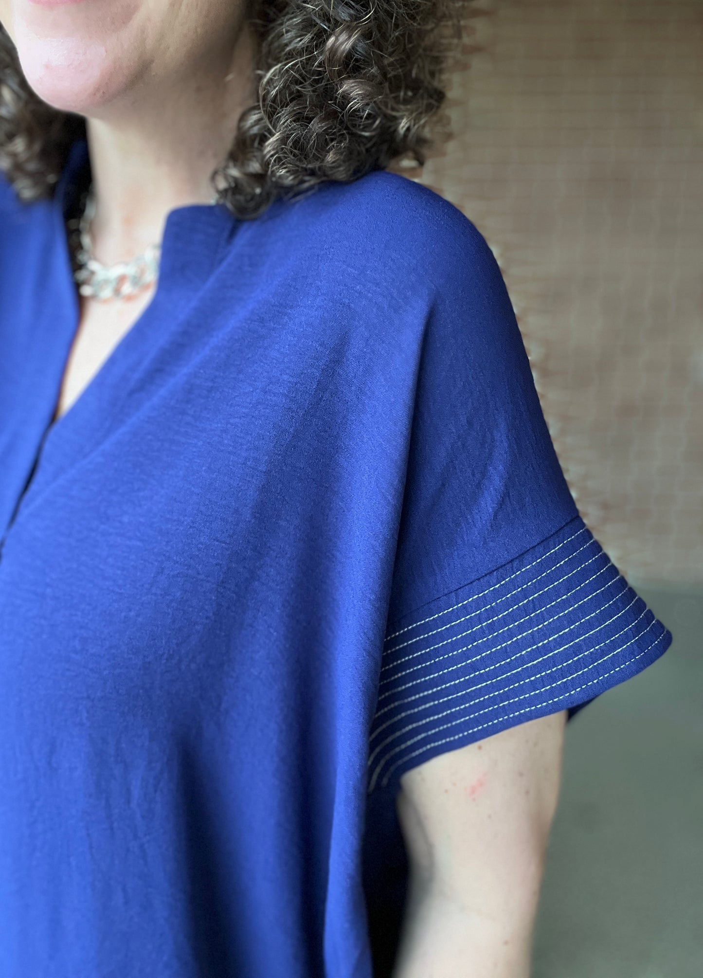 Flowy Split Neck Top with Stitched Trim