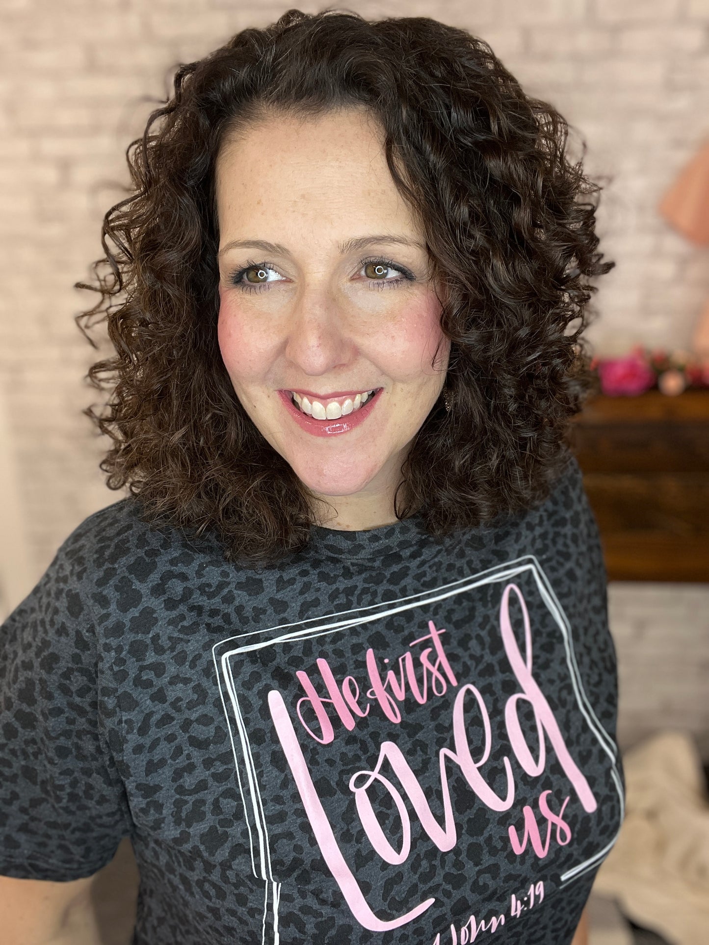 HE FIRST LOVED US Graphic Tee